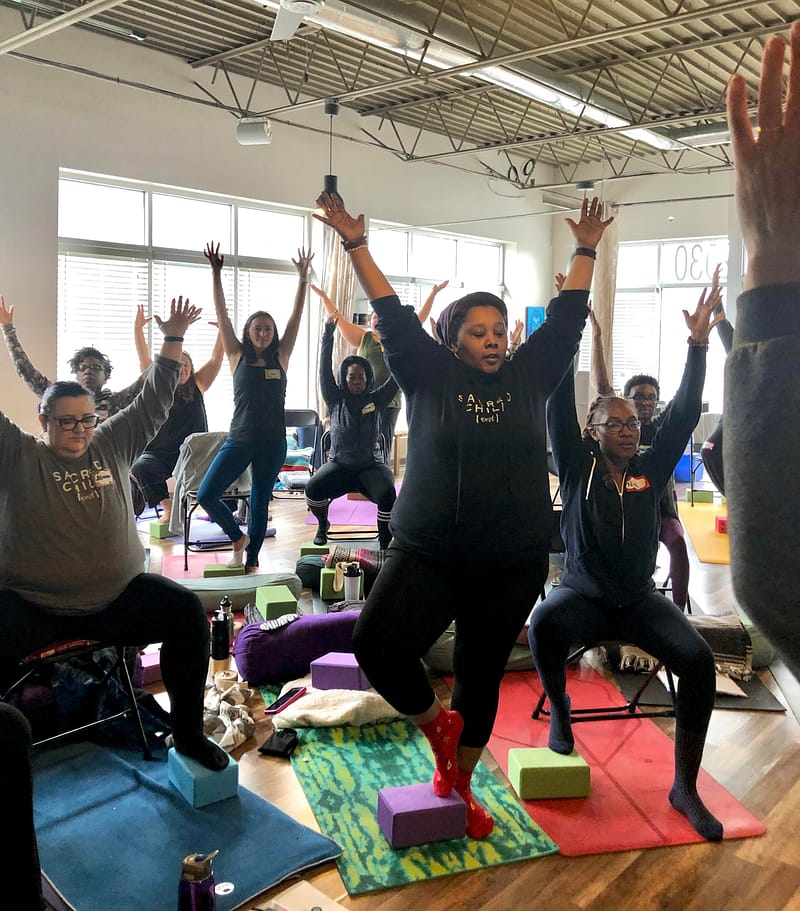Group of mixed abilities practicing yoga together